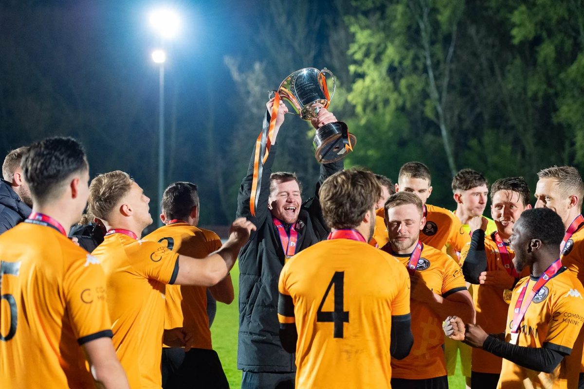 After beating Elstow Abbey 6-0 in the Final, Ben Walsh holds the Senior Beds County Cup up high